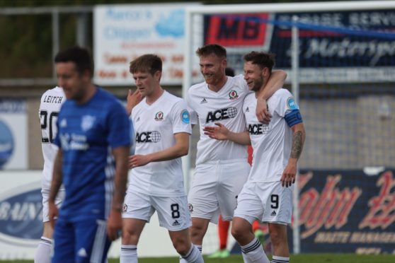 Mitch Megginson is congratulated by Rory McAllister after levelling for Cove Rangers.