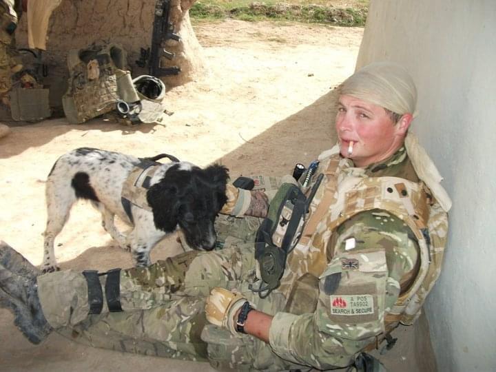 Liam Tasker with military dog Theo