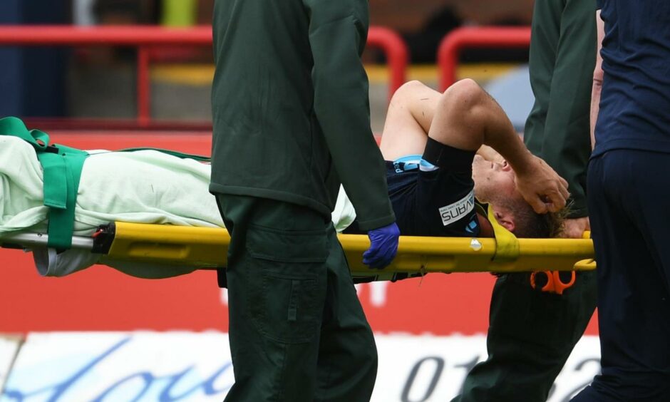 Danny Mullen is stretchered off.