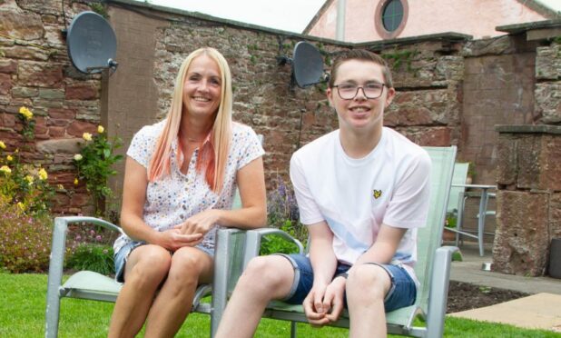 Adam, who has Glut1 deficiency, with mum Stefanie