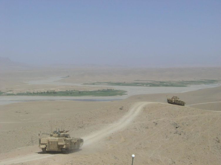 Two 'Warrior' tanks driving in Afghanistan