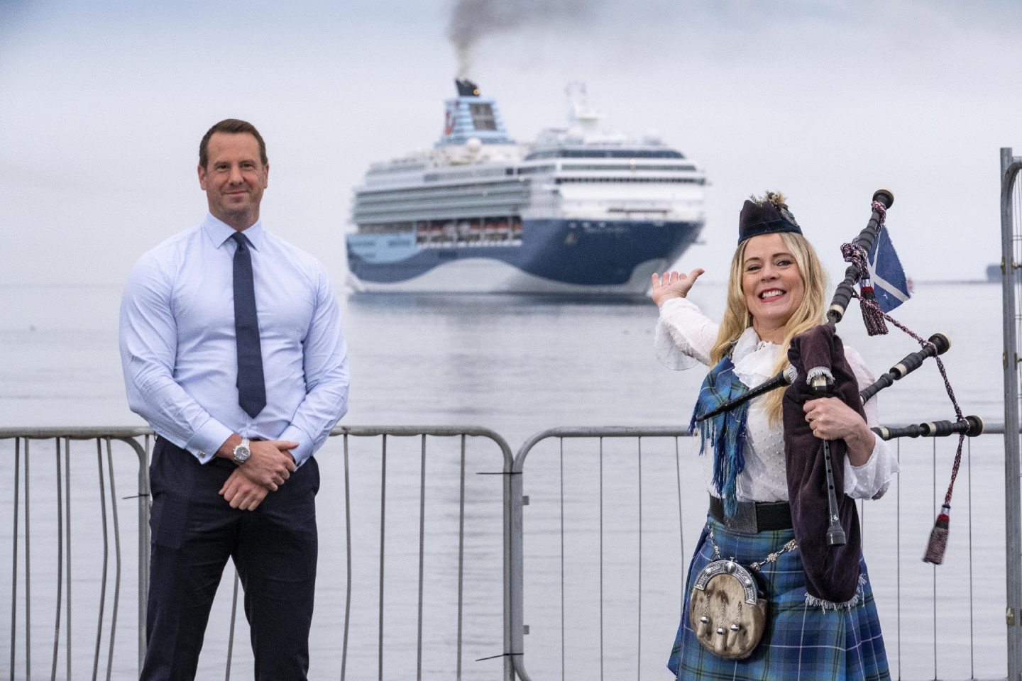 Rob Mason of Forth Ports and Piper Louise Marshall welcome the Marella Explorer 2 to Dundee.