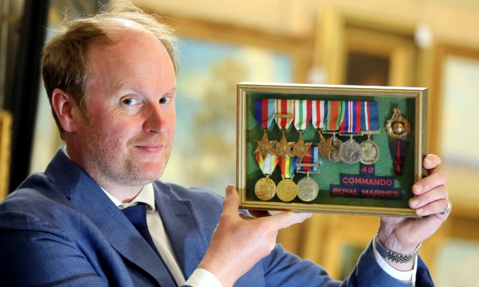 Nick Burns with the war medals of Jock Mathieson.