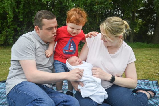 Douglas Ross, wife Krystle, son Alistair and  son James, one week after his birth.