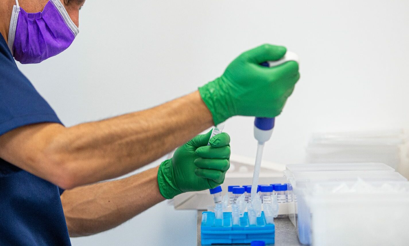 A lab technician processing covid PCR tests at TAC Healthcare in Dyce