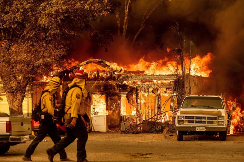 Wildfires tearing through a home in California.