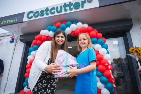 Cancer survivor Madison and shop owner Anila at the shop opening charity event.