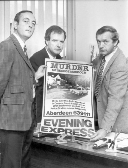 Det Insp Norman McCormack, Det Insp Warren Souden and Det Supt Jim McLeod holding a poster asking for information on the George Murdoch murder