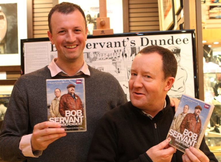 Neil Forsyth and actor Jonathan Watson with copies of the Bob Servant DVD in 2013. Image: DC Thomson.