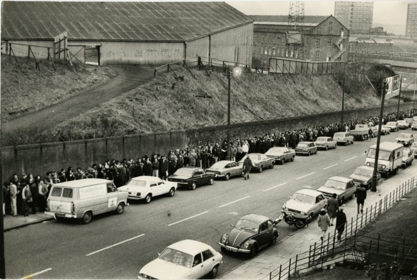 Dundee FC fans queue outside Dens park for tickets for the League Cup final.