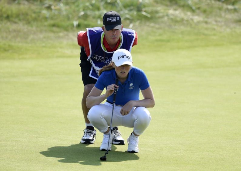 Coach Dean Robertson was a calming influence as caddie for Louise at Carnoustie.