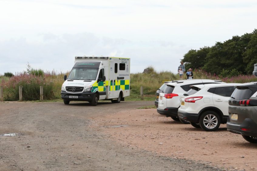 An ambulance waits at Tentsmuir Beach during the rescue of three people.