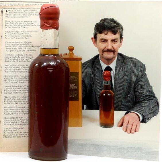 The late Donald McLaren with his winning poem and the bottle of whisky.