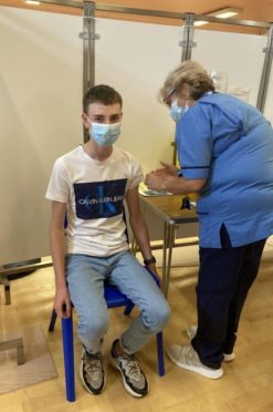 16-year-old Jake Franklin received his first dose of the vaccine