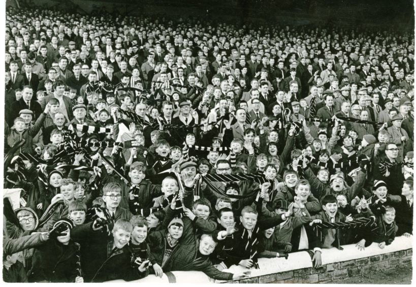The Dundee crowd cheer on at the Dundee Derby at Dens Park on January 2 1969.