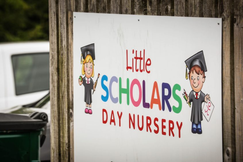A sign for the Little Scholars Day Nursery in Dundee