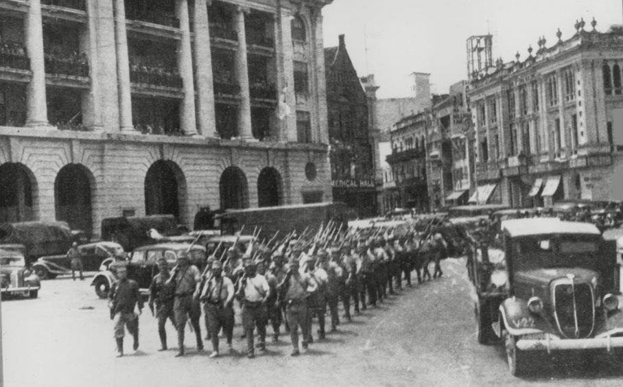 Japanese troops parading near Bartley Place, Singapore.