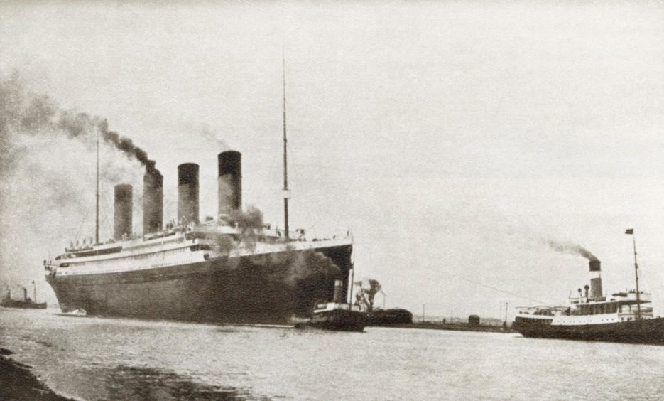 RMS Titanic sets off on her maiden journey from Southampton.