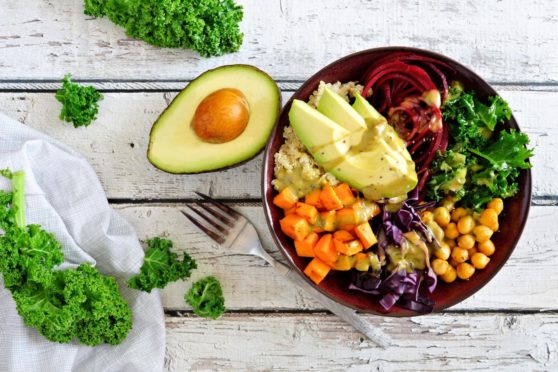 A bowl of healthy immune system-boosting food including avocado, chickpeas and greens