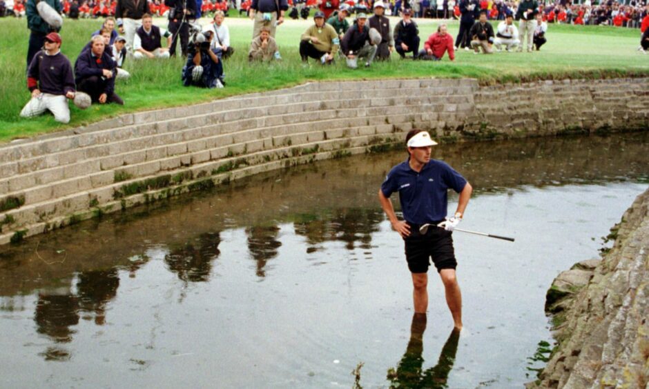 Jean van de Velde in the burn at Carnoustie during the closing stages of the 1999 Open
