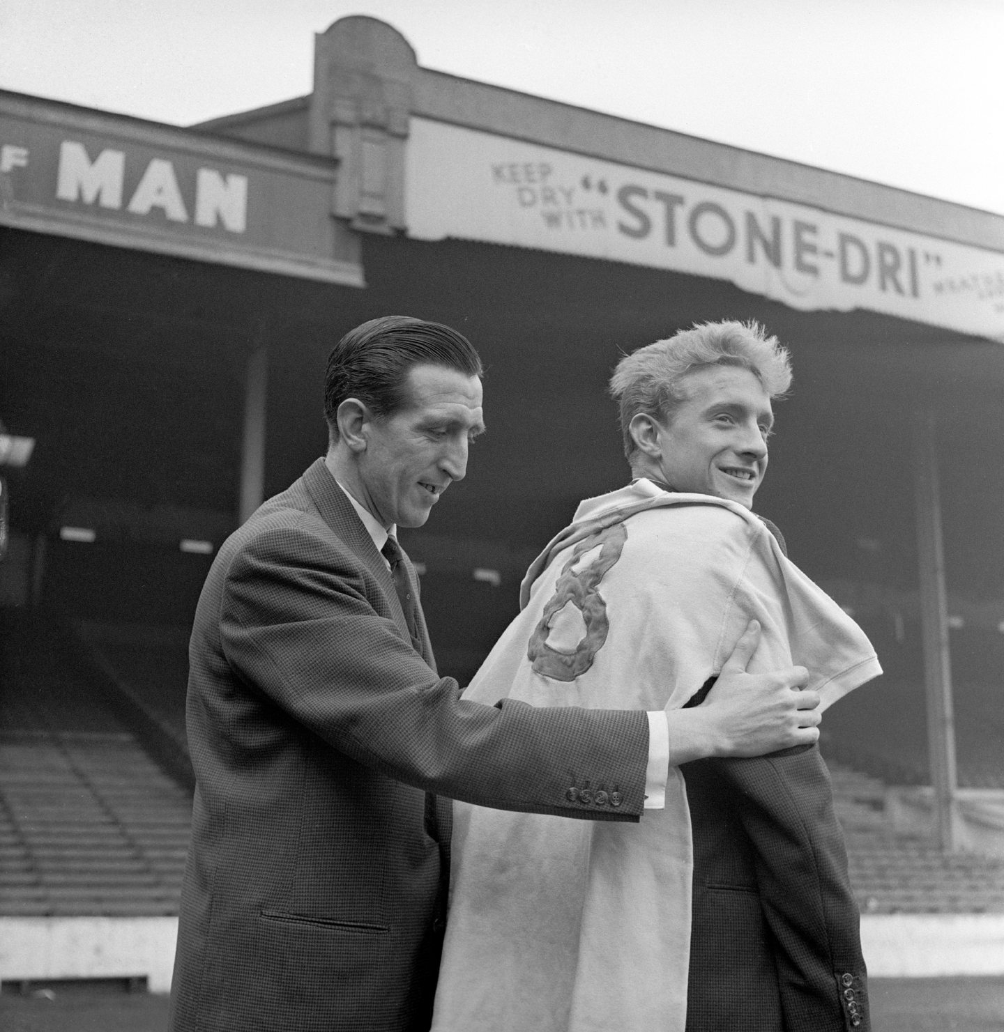 Ken Barnes, captain of Manchester City, with Denis Law after he signed for a record transfer fee in 1960.