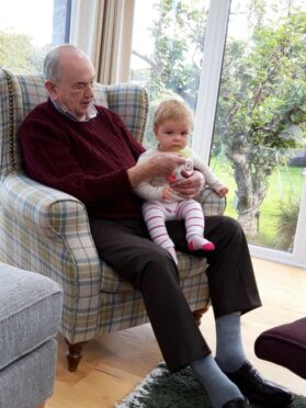 The love he had for his family is shown in this picture of professor Martin with his baby granddaughter