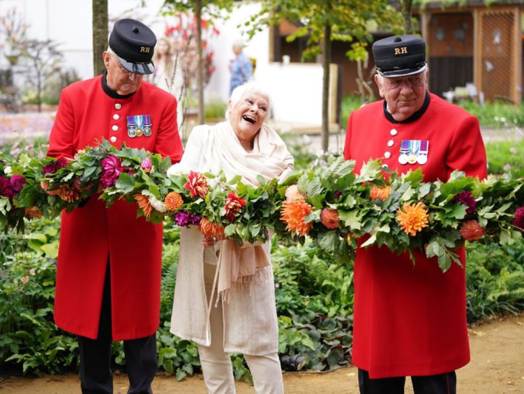 Queen's Garden Canopy ambassador Dame Judi Dench with Chelsea Pensioners at last month's Chelsea Flower Show