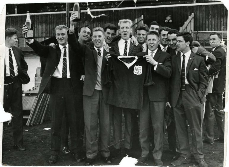 Craig Brown celebrates with his team-mates after Dundee won the league. Image: DC Thomson.