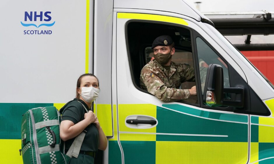 Scottish Ambulance Service Paramedic Amy Young alongside Private Guy Spiers from 68 Squadron of 7th Regiment Royal Logistic Corps.