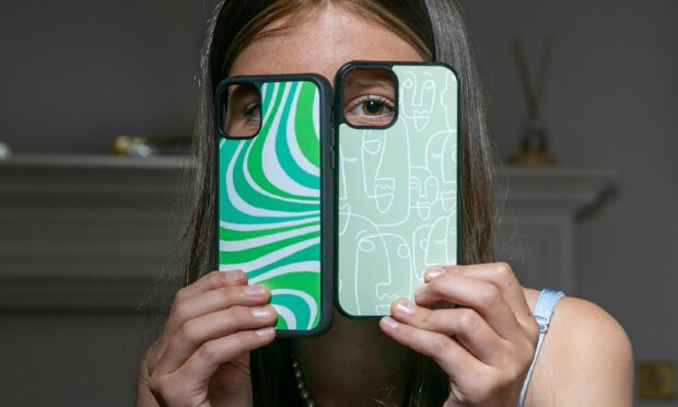 Freya Tyson showing off two of her green Justencaseit cases