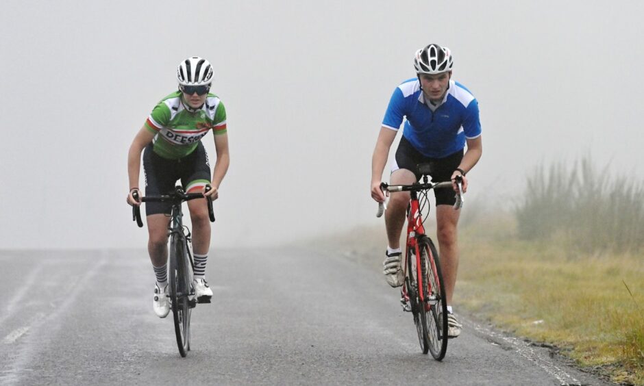 Two cyclists climb the Cairn O'Mount in stage 8 of the Tour of Britain in Aberdeen