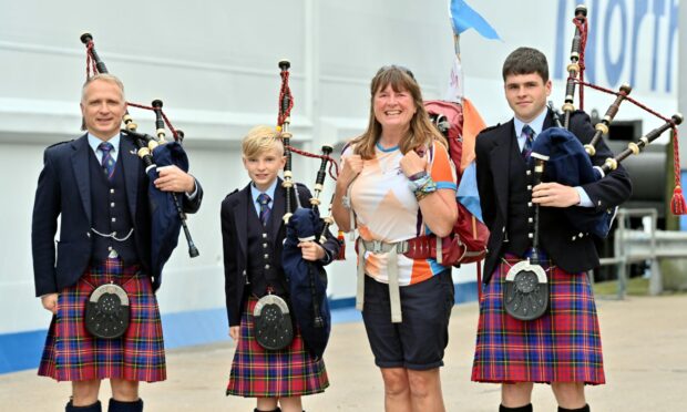 Karen Penny and pipers Neil Mitchell, Craig Mitchell and Gregor Wildgoose 