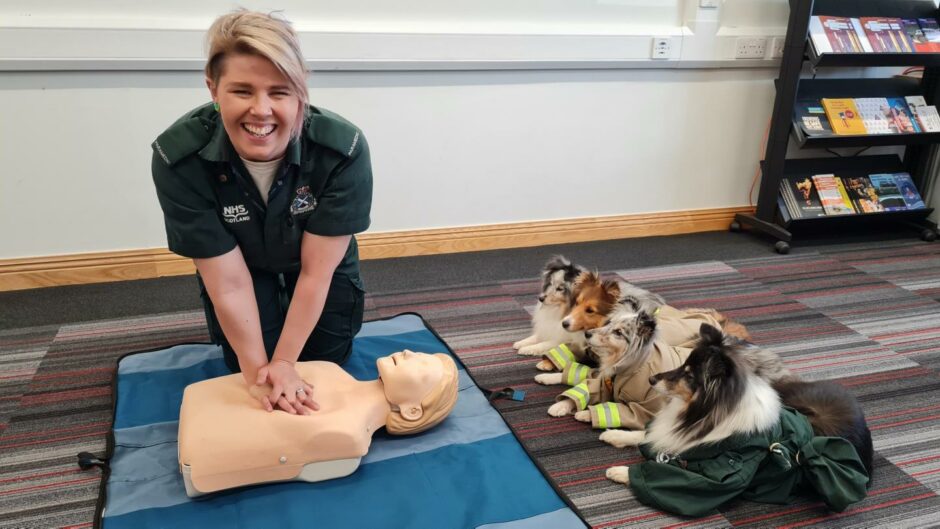 Paramedic Kaylee Garrick with her dogs.