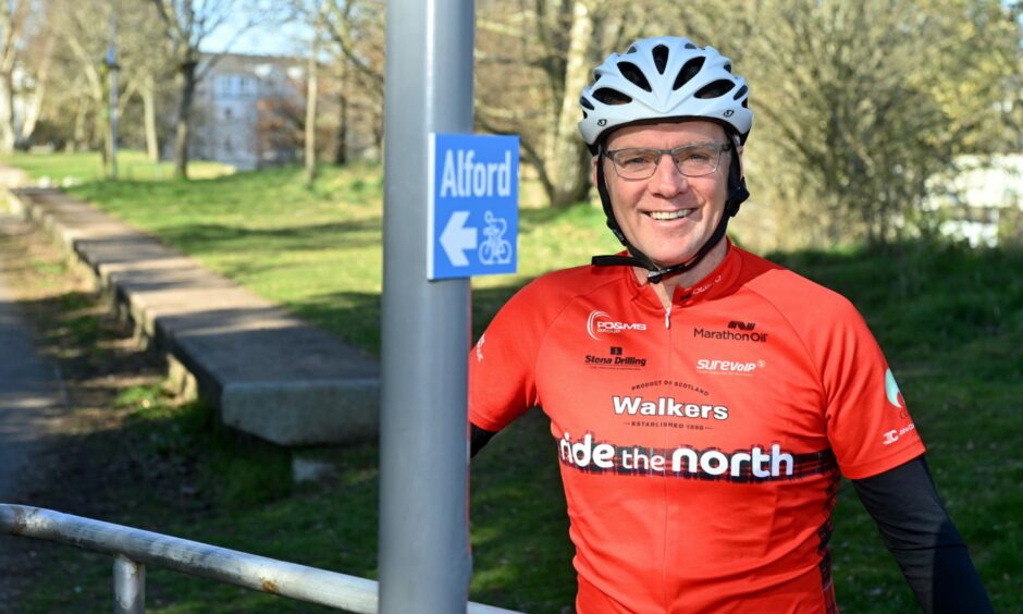 Neil Innes in full cycling attire