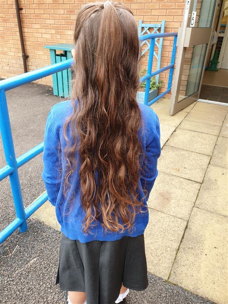 Strathmartine primary pupil Alix's long hair.