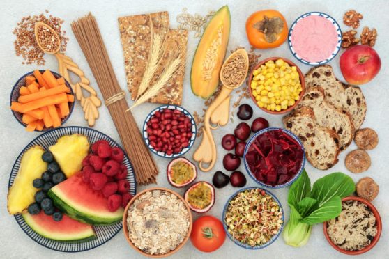 An image showing a plethora of fruit and grains - all the best food to get fibre