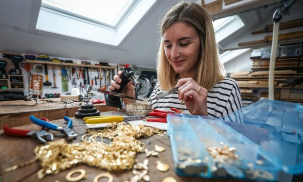 Jane in her workshop creating Paper People jewellery.