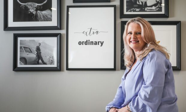 Jane Rennie from the Extraordinary Training Company in front of a picture that says extraordinary