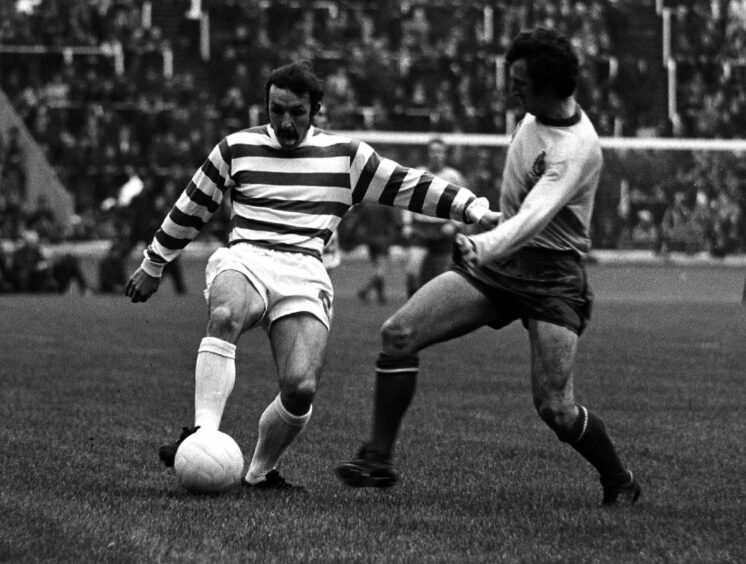 Celtic's Jim Brogan takes on Denis McQuade.