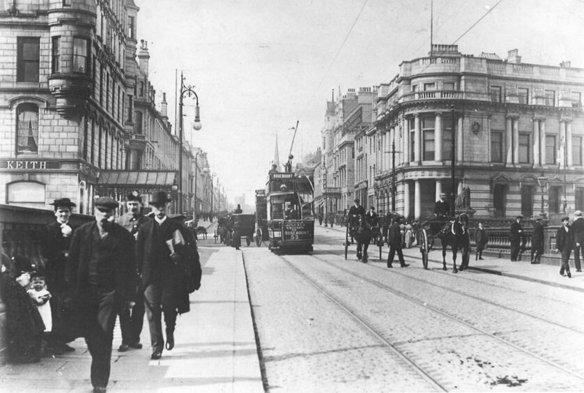 Trams and horse-drawn carriages on Union Street in Aberdeen in 1900.