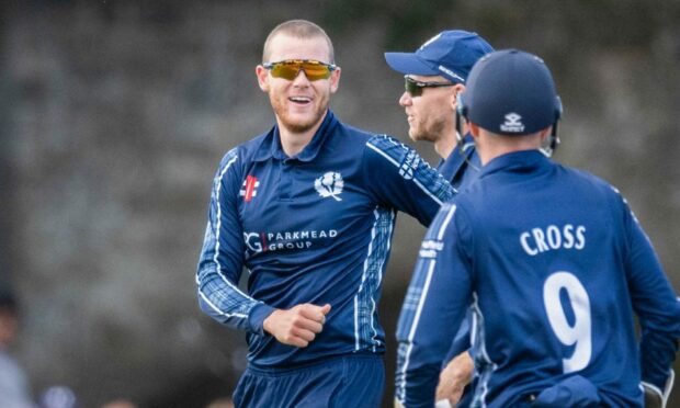 Scotland international Michael Leask, centre.