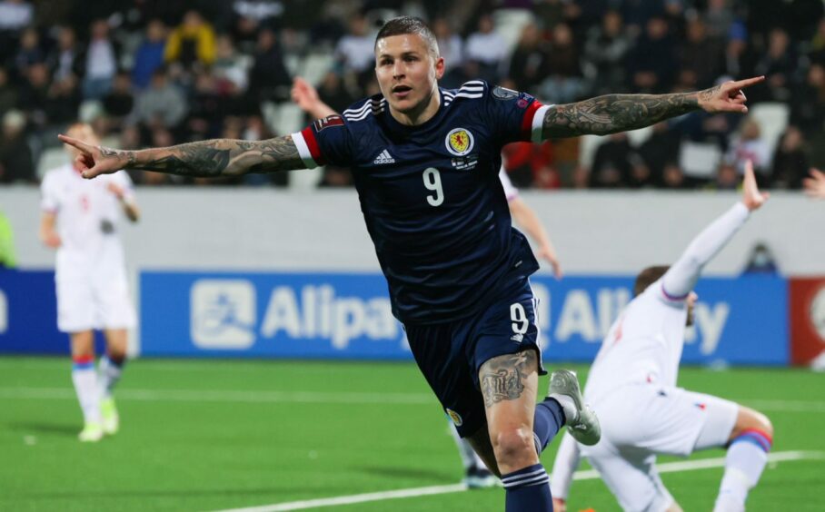 Lyndon Dykes celebrates his late winner for Scotland against the Faroes.