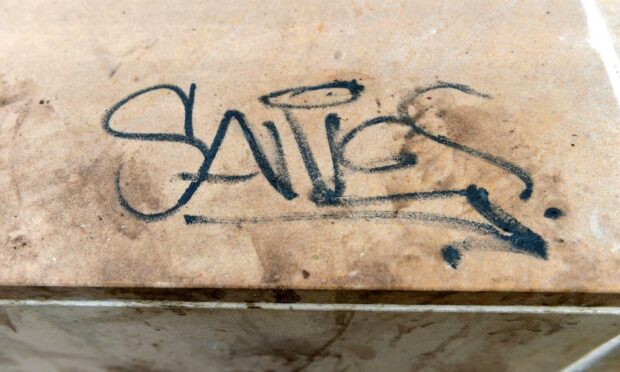 Image of vandalism writing on new River Ness public artwork.