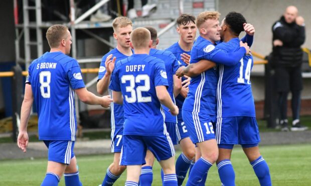 Peterhead players celebrate Niah Payne's opener.