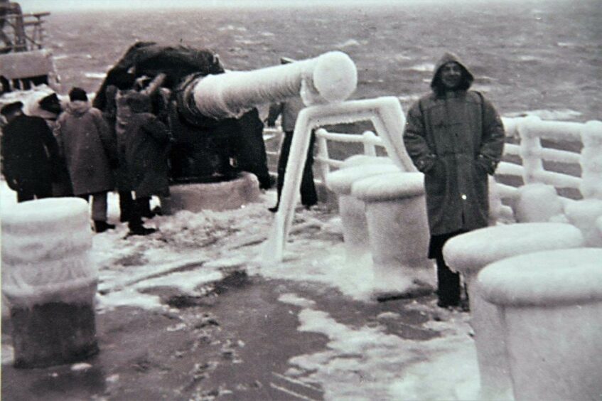 A man on the frozen deck of an Arctic convoy ship.