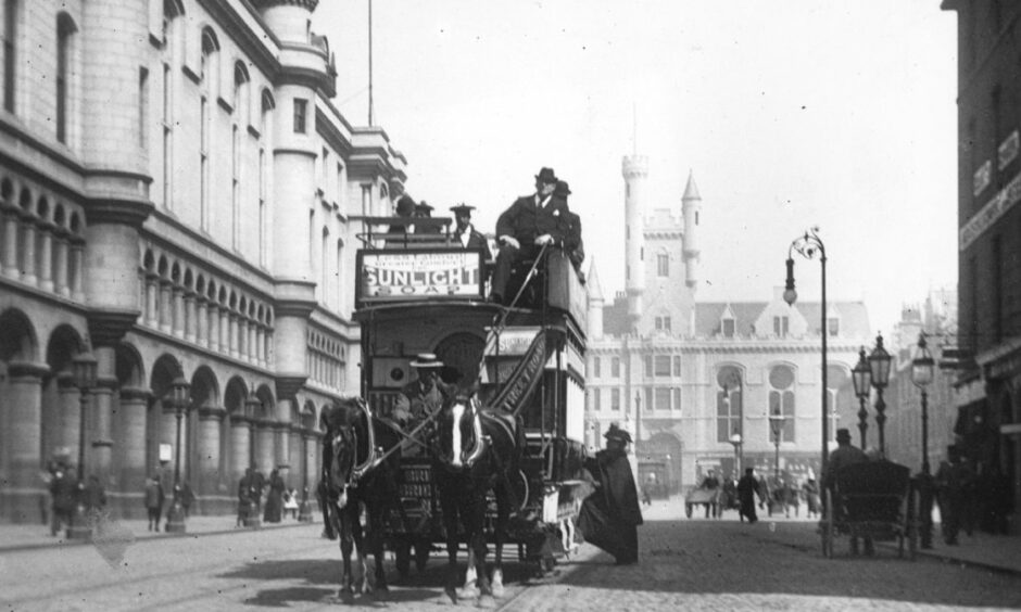 A horse-drawn tram on Castle Street in Aberdeen during the late 1800s.