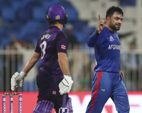 Afghanistan's Rashid Khan celebrates the dismissal of Scotland all-rounder Chris Greaves.