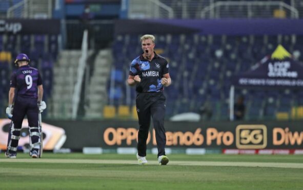 Namibia's Ruben Trumpelmann celebrates the dismissal of Scotland's George Munsey.