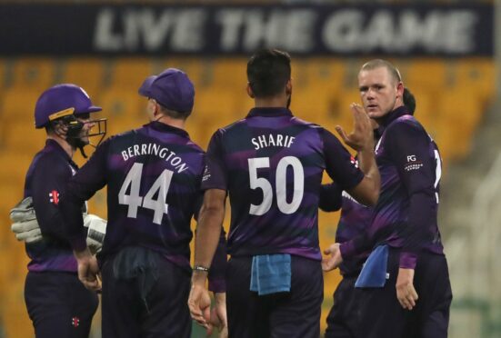 Scotland's Michael Leask, right, celebrates the dismissal of Namibia's captain Gerhard Erasmus.