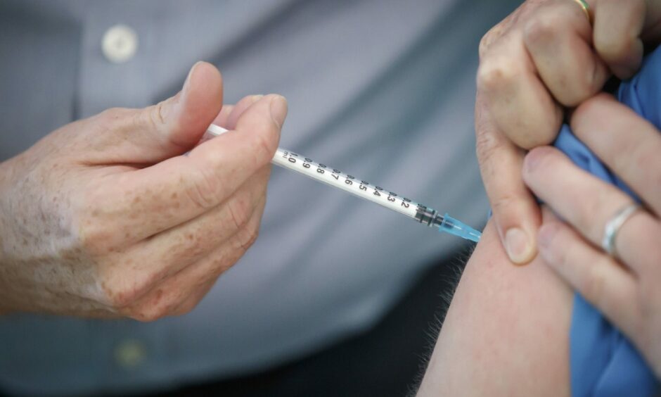 Covid vaccine being administered. 